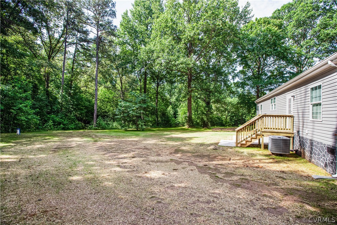 411 Goodwin Store Road Louisa, VA 23093 - Photo 34 of 38 a view of a house with backyard and trees