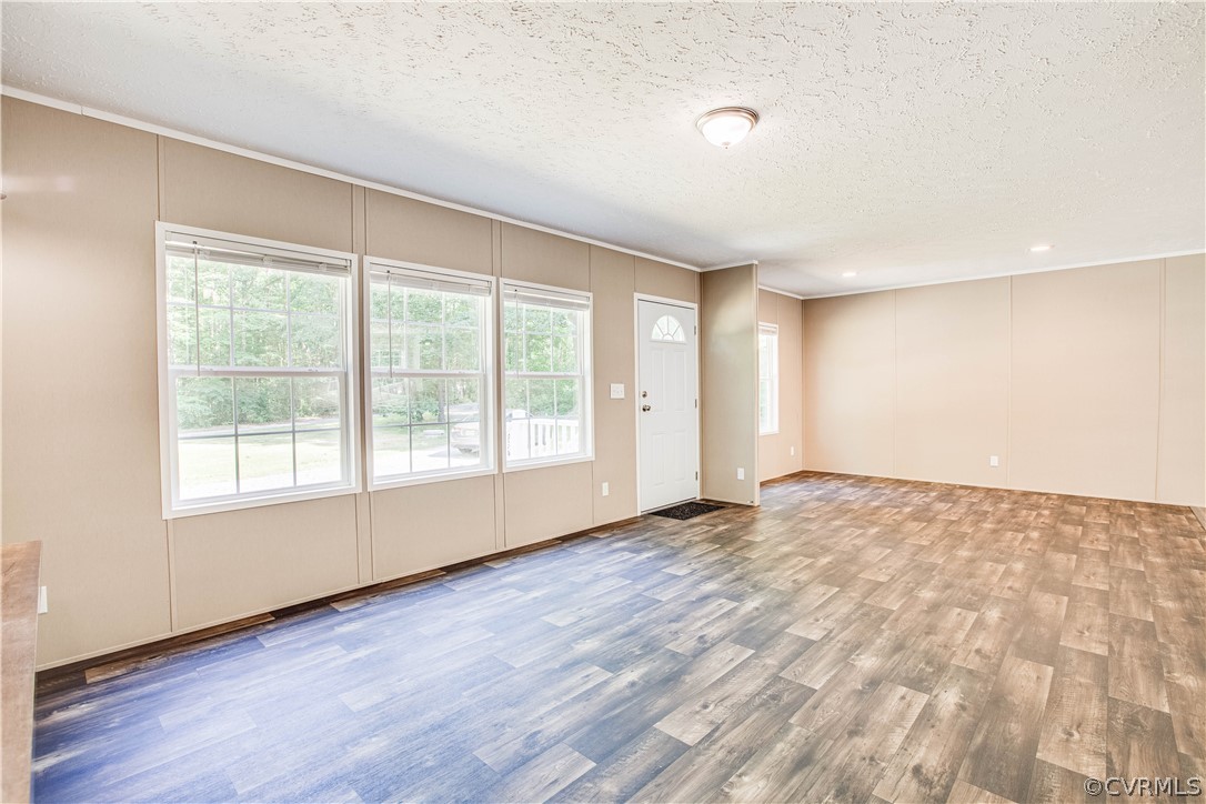 411 Goodwin Store Road Louisa, VA 23093 - Photo 38 of 38 an empty room with wooden floor and windows