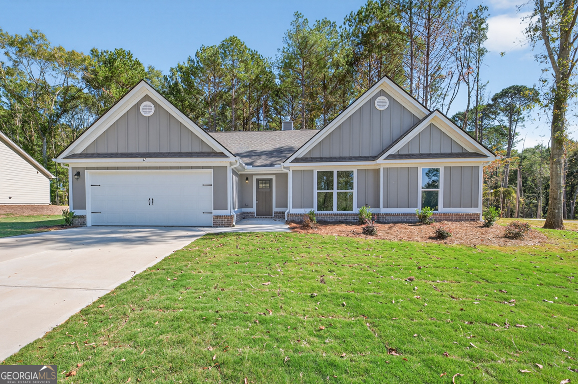 274 Mockingbird Lane, Unit 27 Winder, GA 30680 - Photo 2 of 29 a house view with a garden space and backyard