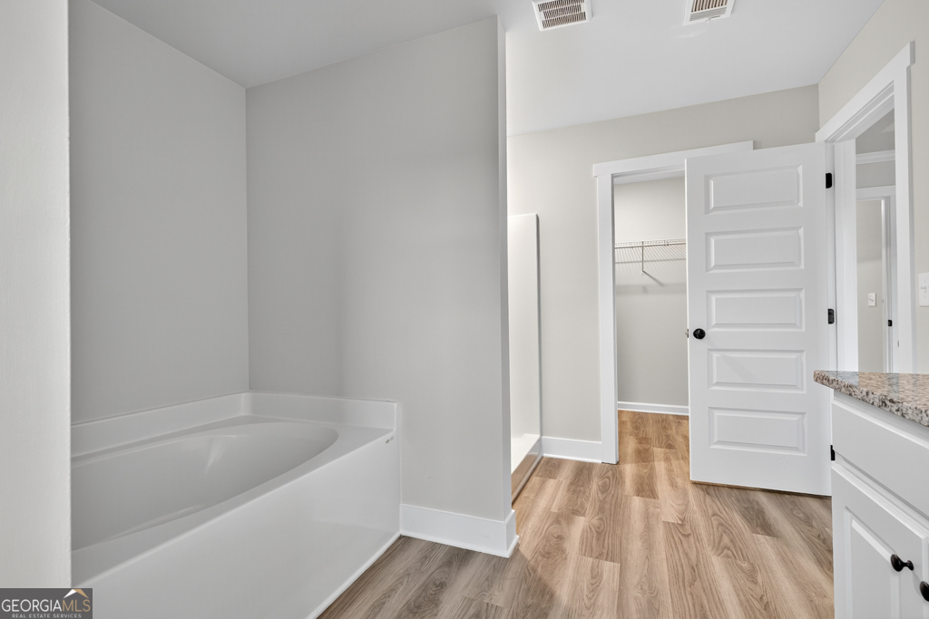 274 Mockingbird Lane, Unit 27 Winder, GA 30680 - Photo 25 of 29 a bathroom with a bathtub and shower