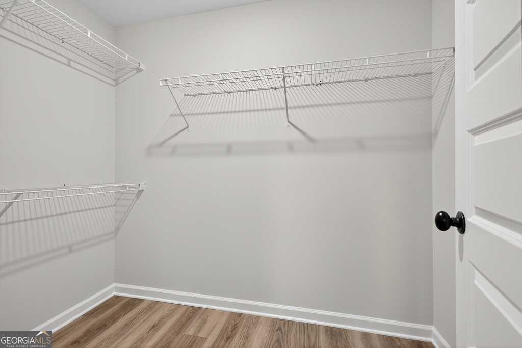 274 Mockingbird Lane, Unit 27 Winder, GA 30680 - Photo 26 of 29 a view of a room with racks on the wall