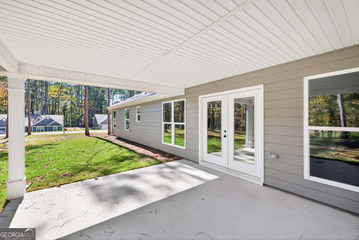274 Mockingbird Lane, Unit 27 Winder, GA 30680 - Photo 29 of 29 a view of a house with a backyard