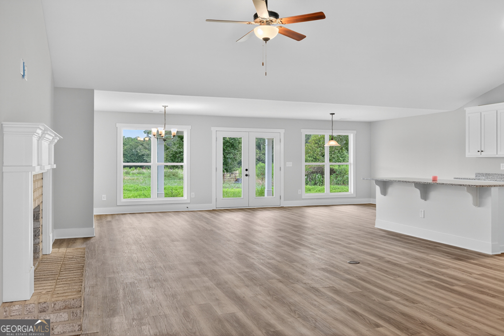 274 Mockingbird Lane, Unit 27 Winder, GA 30680 - Photo 3 of 29 a view of an empty room with a window and wooden floor