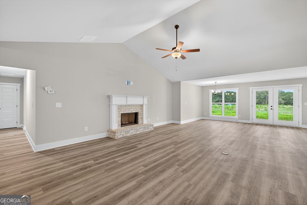 274 Mockingbird Lane, Unit 27 Winder, GA 30680 - Photo 5 of 29 a view of empty room with wooden floor and fan