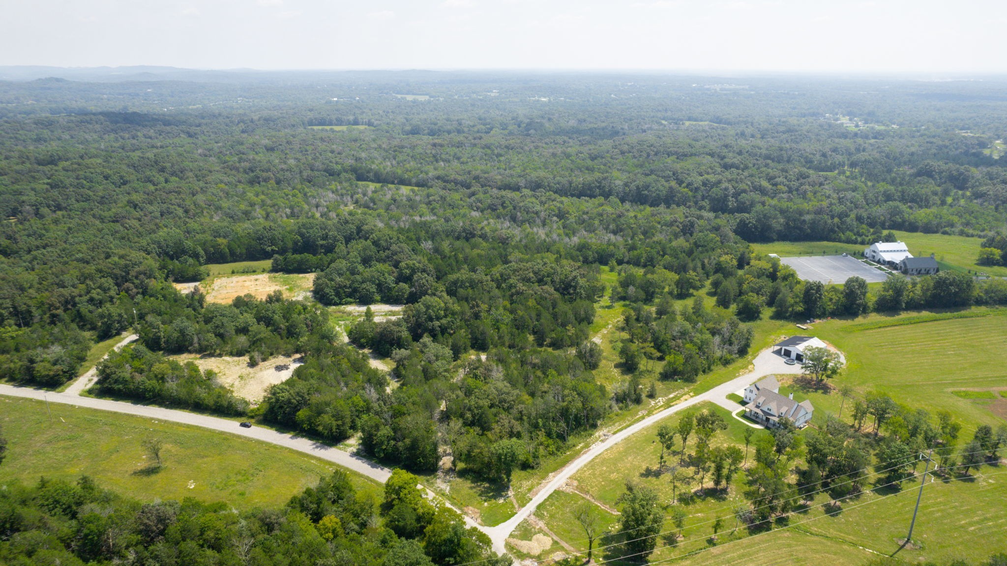 0 Ollie Chunn Road Spring Hill, TN 37174 - Photo 3 of 16 an aerial view of a house with a yard and lake view