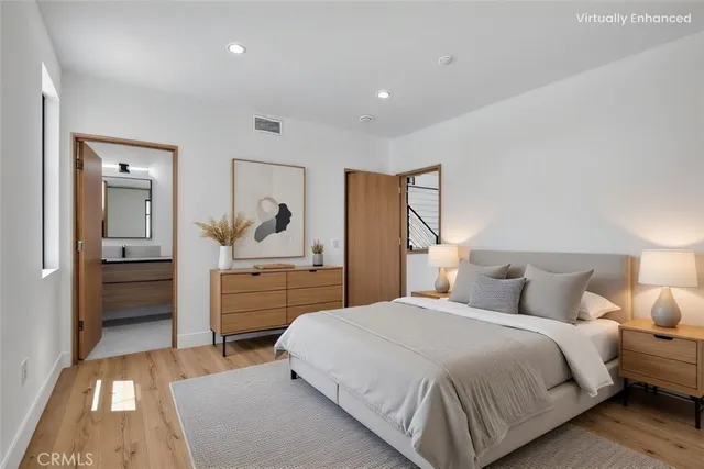 a bathroom with a double vanity sink mirror and glass door