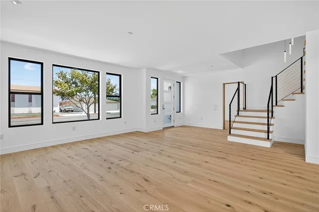 a large kitchen with stainless steel appliances granite countertop a sink and cabinets