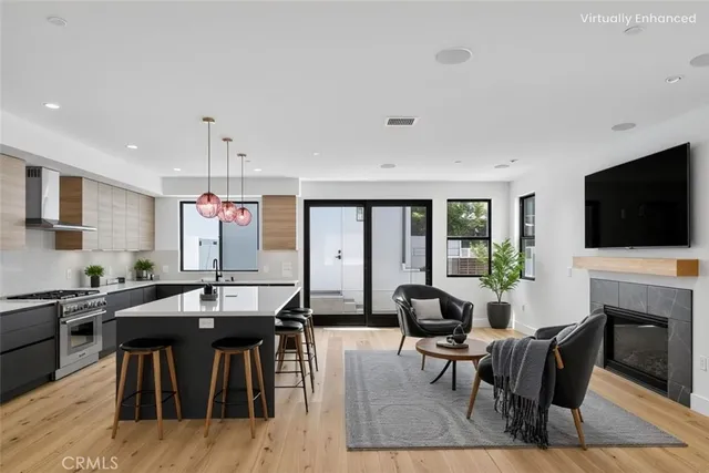 a kitchen with a sink a counter space cabinets and stainless steel appliances