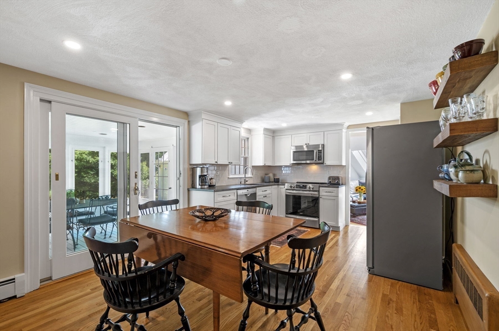 44 Walnut Road Hamilton, MA 01982 - Photo 13 of 39 a open dining room with stainless steel appliances a dining table and chairs