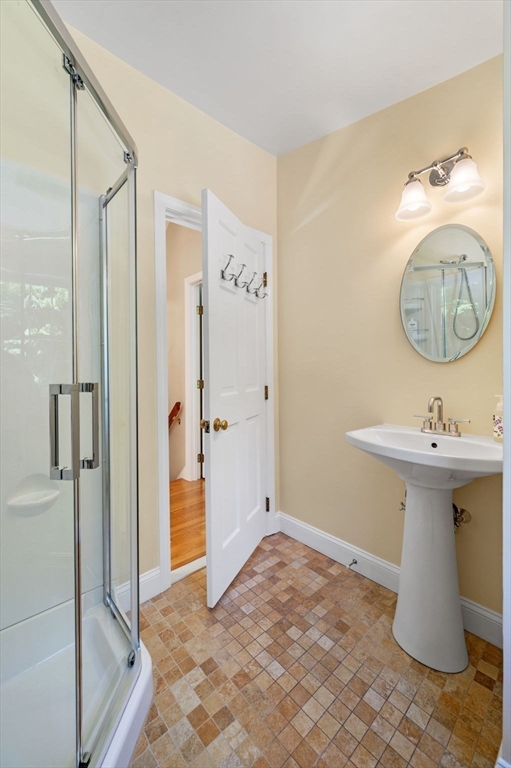 44 Walnut Road Hamilton, MA 01982 - Photo 25 of 39 a bathroom with a sink and a mirror