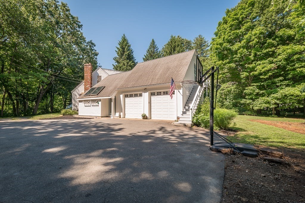 44 Walnut Road Hamilton, MA 01982 - Photo 36 of 39 a view of a house with backyard and a tree