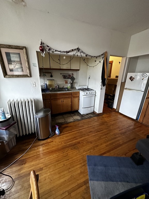 a room with wooden floors and furniture