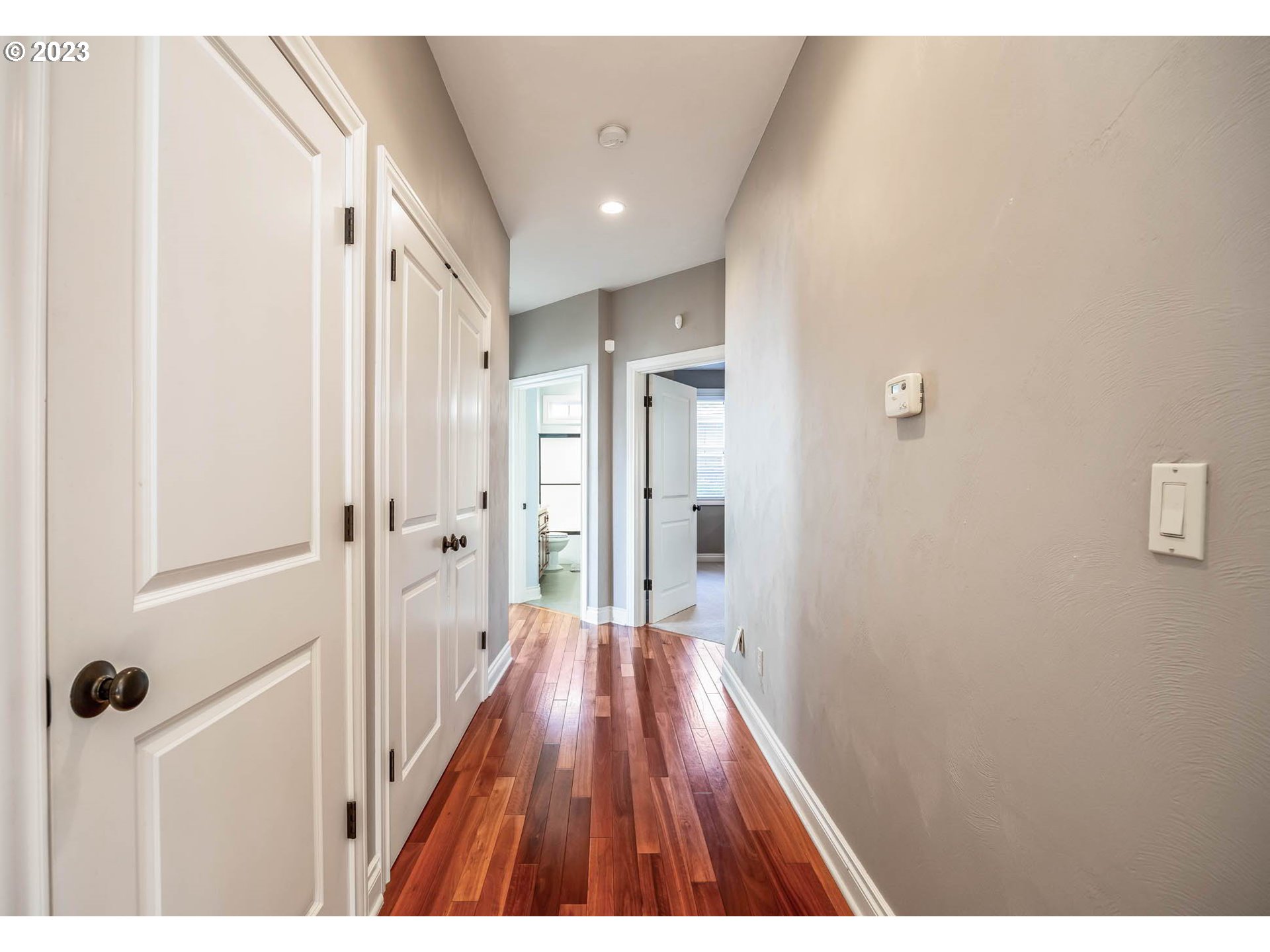 3349 Roanoke Avenue Eugene, OR 97408 - Photo 15 of 36 a view of a hallway with wooden floor