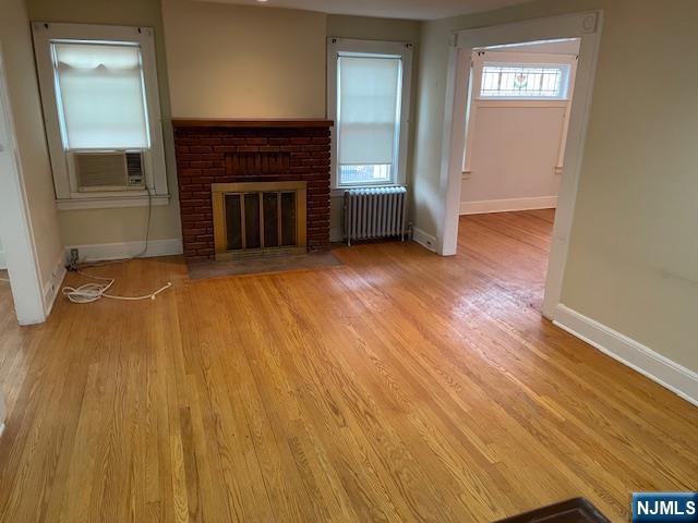 64 Beech Street Rutherford, NJ 07070 - Photo 2 of 17 wooden floor fireplace and natural light
