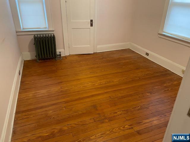 64 Beech Street Rutherford, NJ 07070 - Photo 9 of 17 a view of a room with an empty space and a window