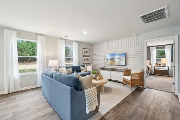 a living room with furniture and a large window