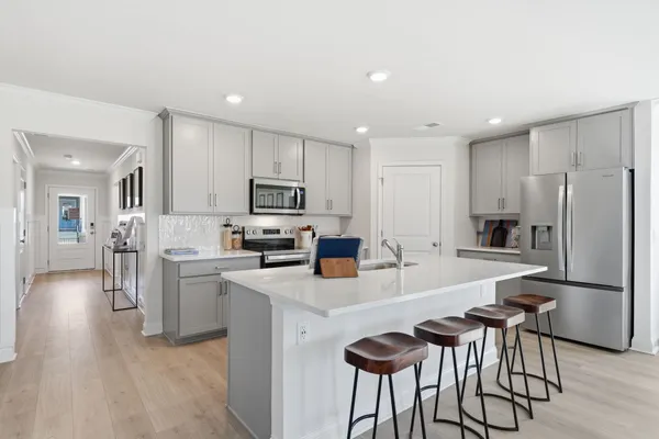 a kitchen with a sink and cabinets