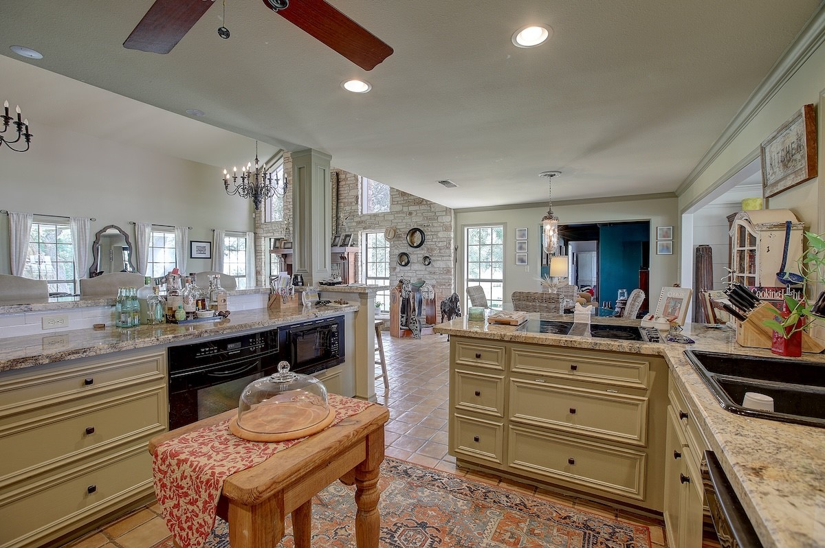 4214 Old College Road La Grange, TX 78945 - Photo 18 of 42 a kitchen with a stove and a refrigerator