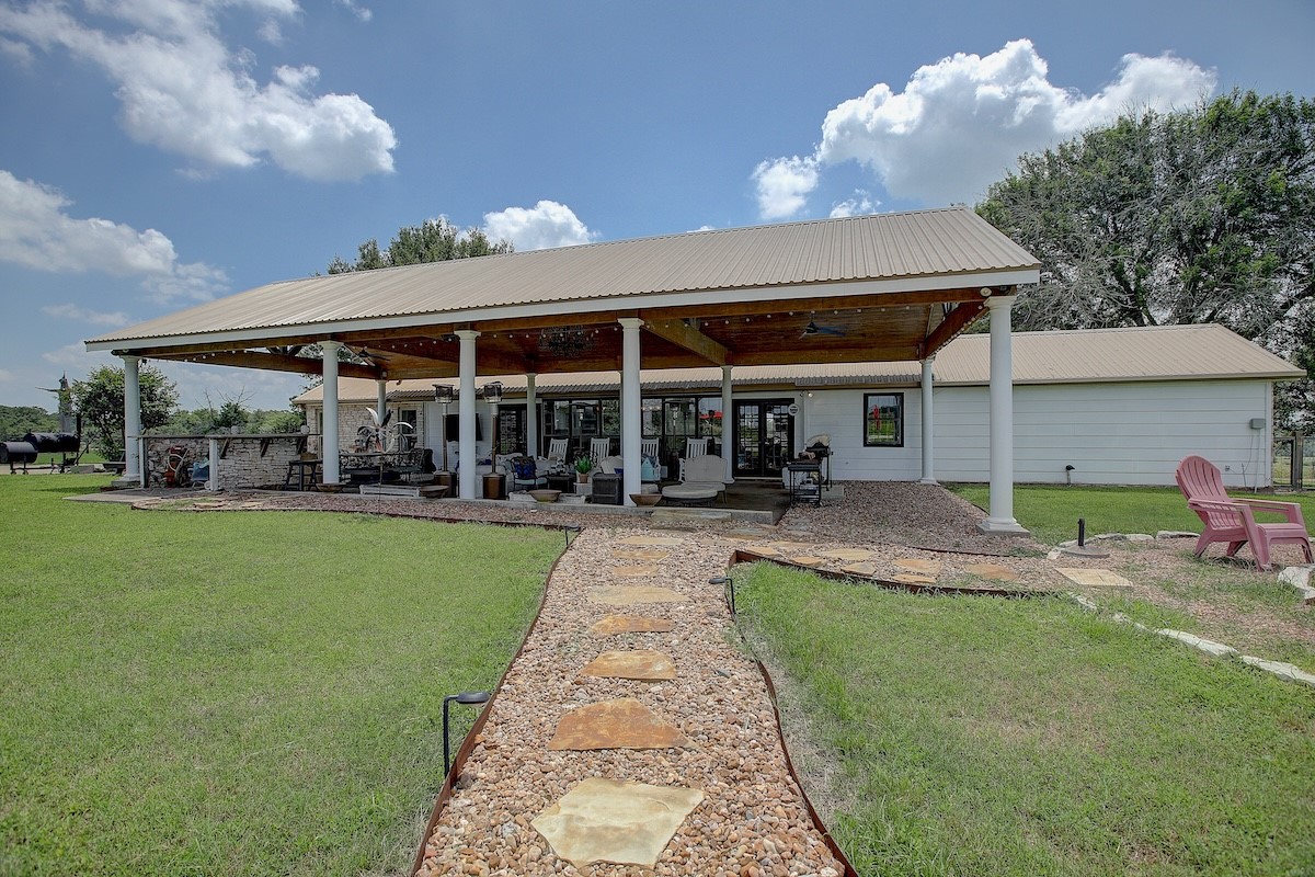 4214 Old College Road La Grange, TX 78945 - Photo 23 of 42 a view of a house with a backyard