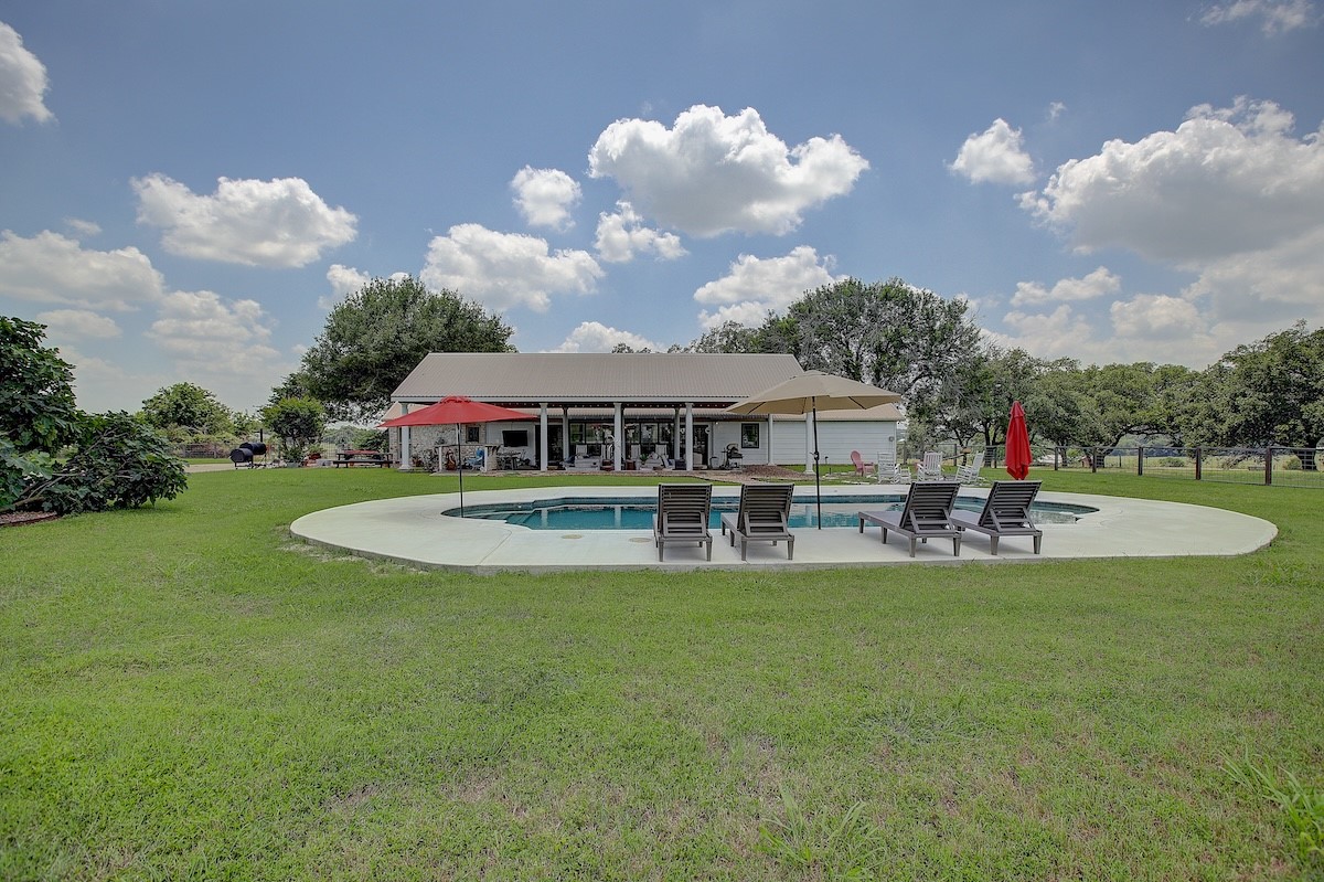 4214 Old College Road La Grange, TX 78945 - Photo 24 of 42 a view of a house with swimming pool and sitting area