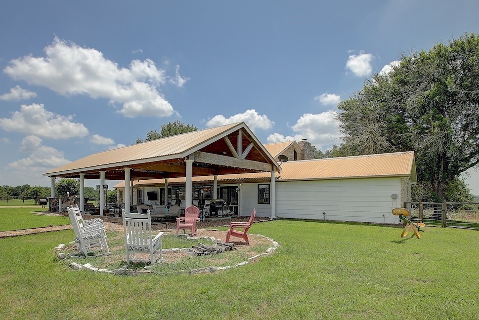 4214 Old College Road La Grange, TX 78945 - Photo 26 of 42 a front view of a house with swimming pool and garden