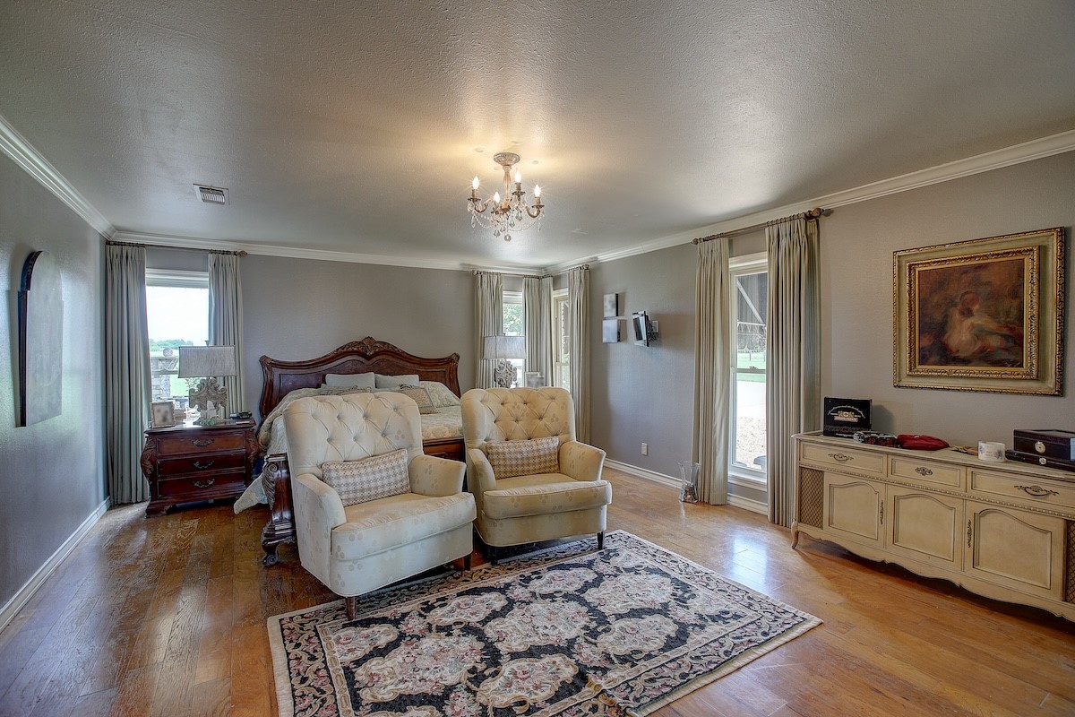 4214 Old College Road La Grange, TX 78945 - Photo 32 of 42 a bedroom with a bed and wooden floor