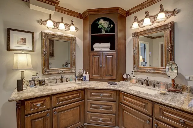 a bathroom with a sink double vanity and a mirror