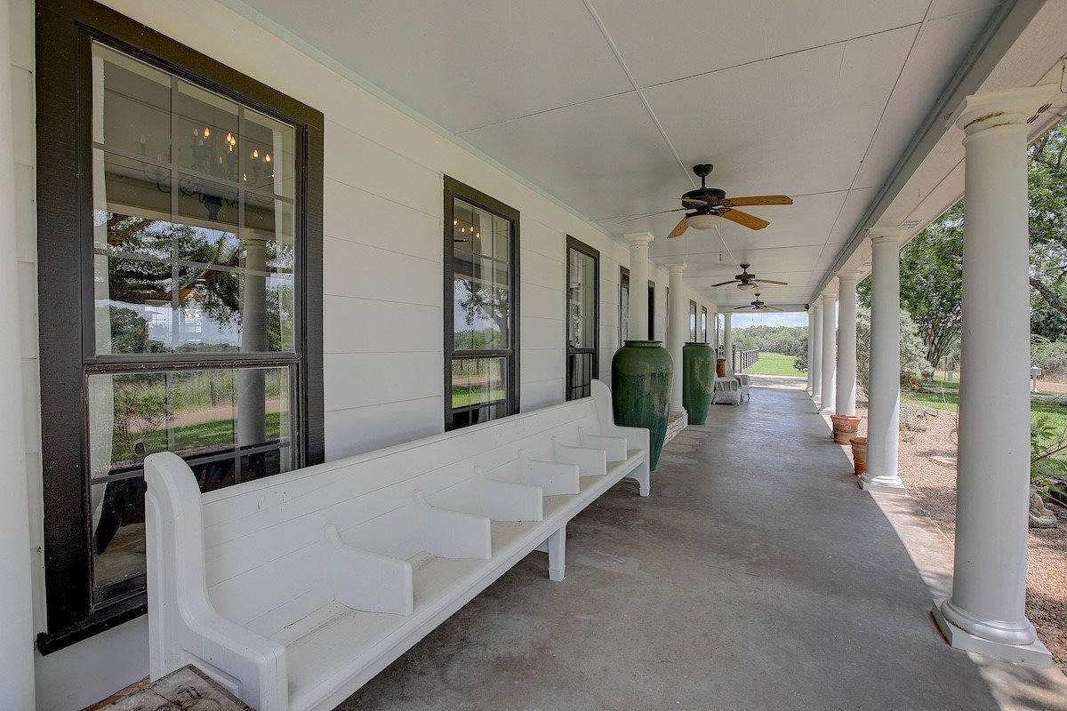 4214 Old College Road La Grange, TX 78945 - Photo 4 of 42 a living room with furniture a chandelier and a large window