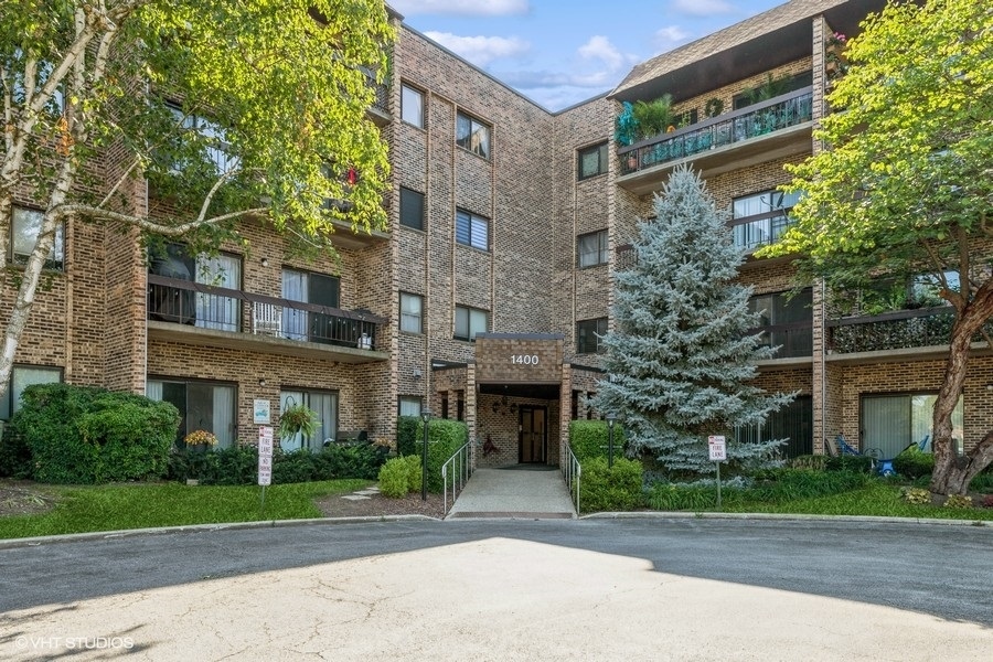 1400 North Elmhurst Road, Unit 411 Mount Prospect, IL 60056 - Photo 1 of 13 a front view of a building
