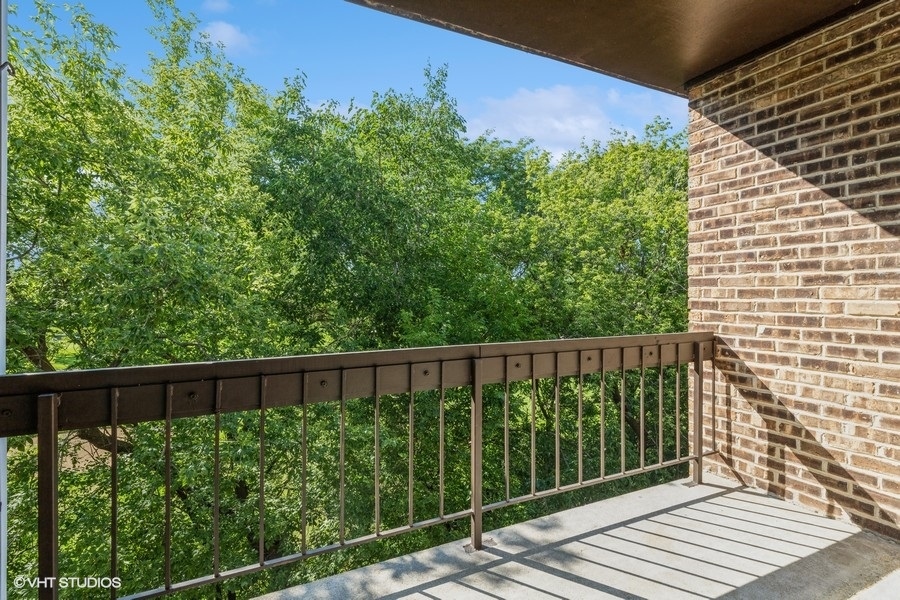 1400 North Elmhurst Road, Unit 411 Mount Prospect, IL 60056 - Photo 12 of 13 a view of a balcony with wooden floor