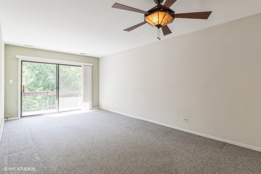 1400 North Elmhurst Road, Unit 411 Mount Prospect, IL 60056 - Photo 5 of 13 a view of a room with a window