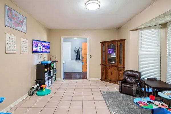 a view of a livingroom with couch and a window