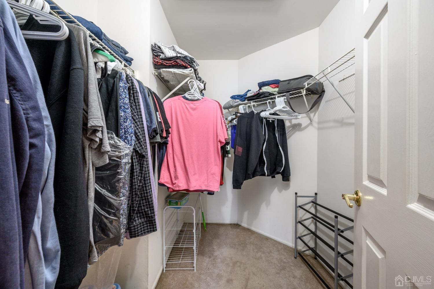 89 Friendship Road Howell, NJ 07731 - Photo 26 of 43 a view of walk in closet with clothes