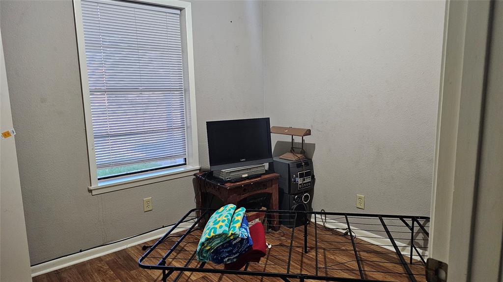 606 Hunter Street Bonham, TX 75418 - Photo 4 of 9 a room with storage and utility