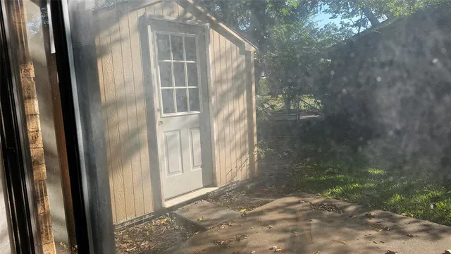 a view of a glass door of a house