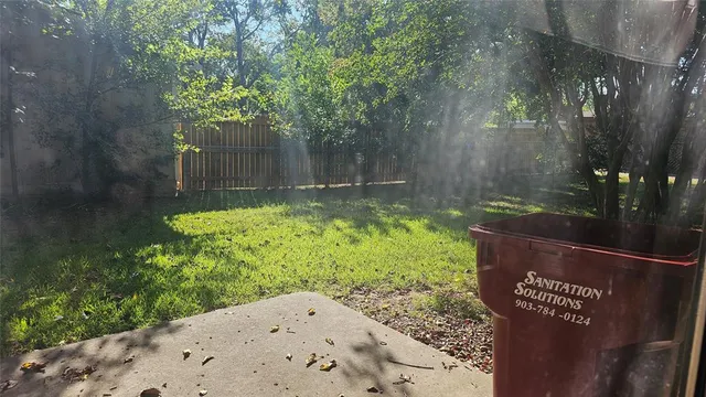 a view of a back yard of the house