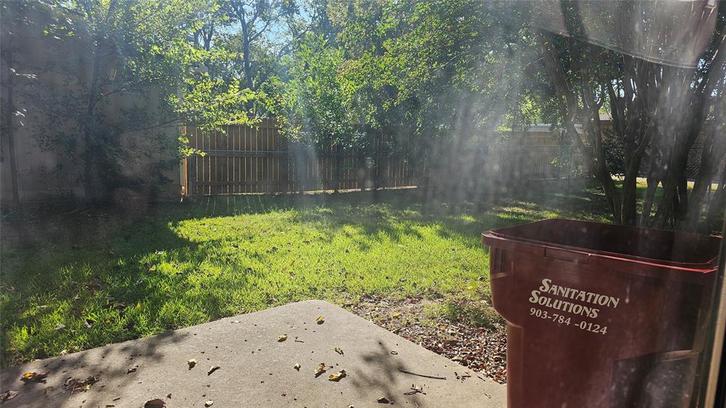 606 Hunter Street Bonham, TX 75418 - Photo 9 of 9 a view of a back yard of the house