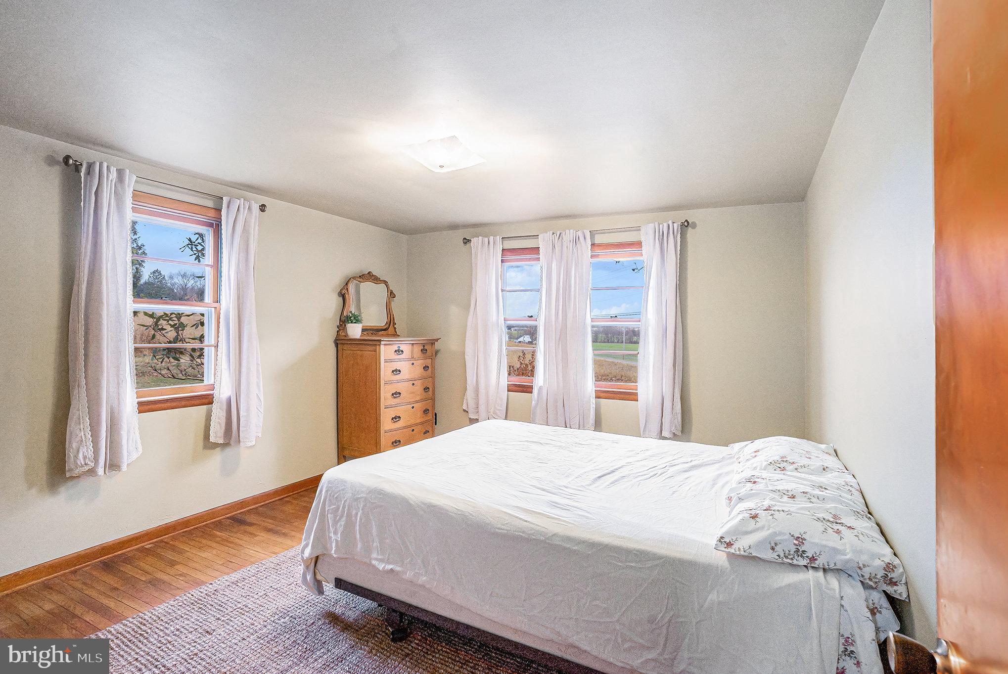 2390 Old Rte 100 Barto, PA 19504 - Photo 15 of 44 a bedroom with a large bed and a window