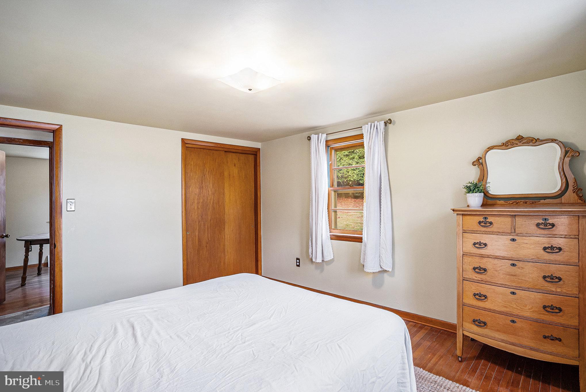 2390 Old Rte 100 Barto, PA 19504 - Photo 17 of 44 a bedroom with a bed and a dresser