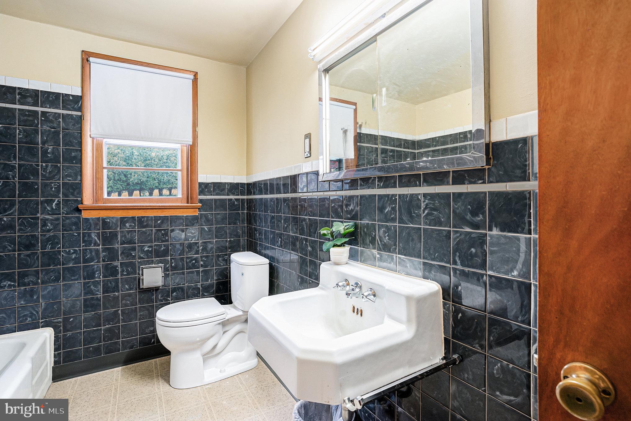2390 Old Rte 100 Barto, PA 19504 - Photo 20 of 44 a bathroom with a sink toilet and a mirror