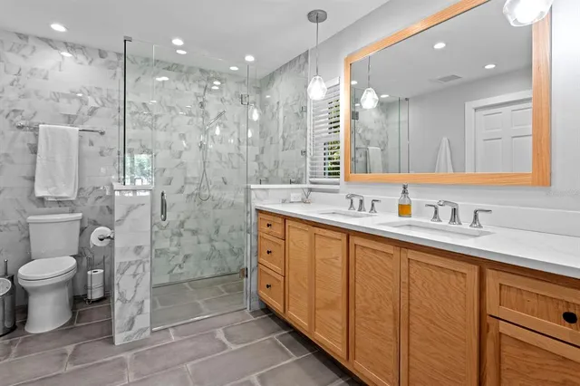 a bathroom with a shower and a toilet