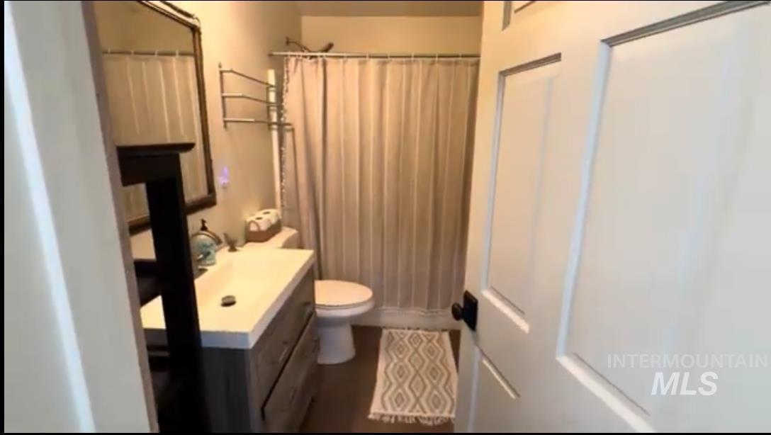 263 Glory Lane Orofino, ID 83544 - Photo 14 of 48 Bathroom featuring a shower with shower curtain and vanity