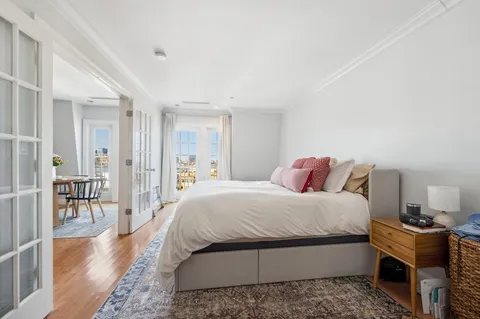 a bedroom with a bed and a table