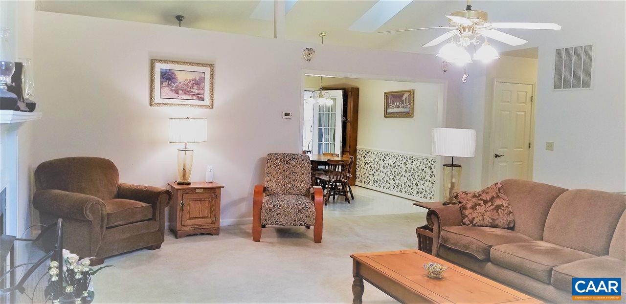 13 Colonial Road Palmyra, VA 22963 - Photo 11 of 34 a living room with furniture and a chandelier
