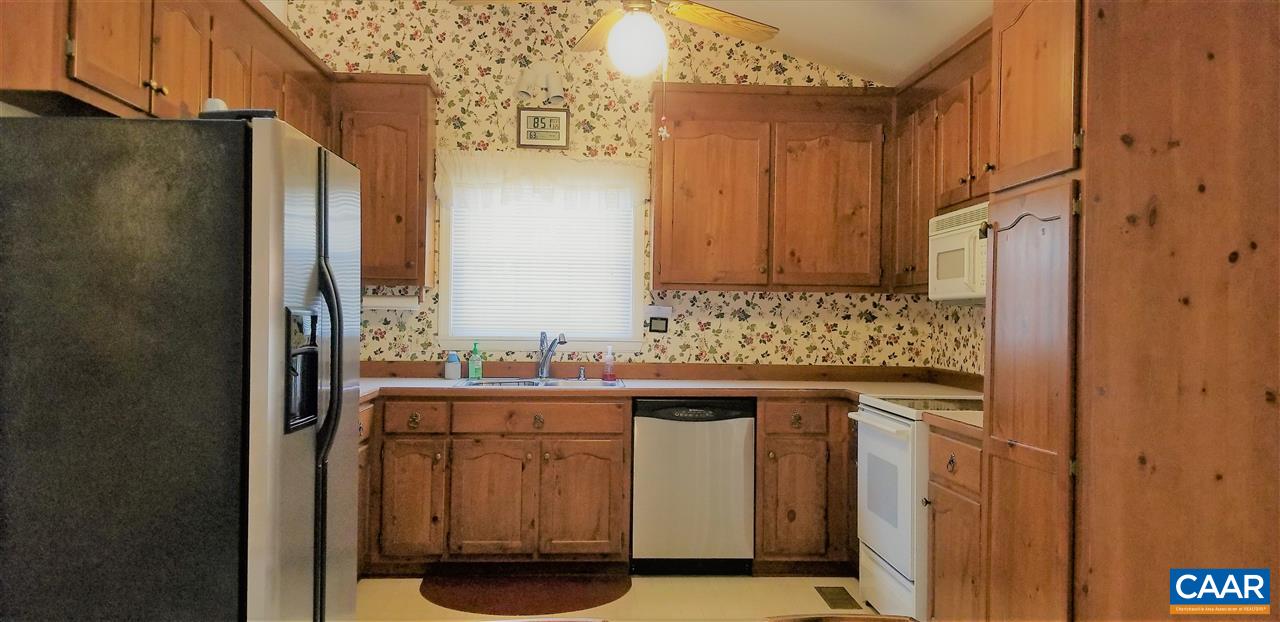 13 Colonial Road Palmyra, VA 22963 - Photo 13 of 34 a kitchen with stainless steel appliances granite countertop a sink and a refrigerator