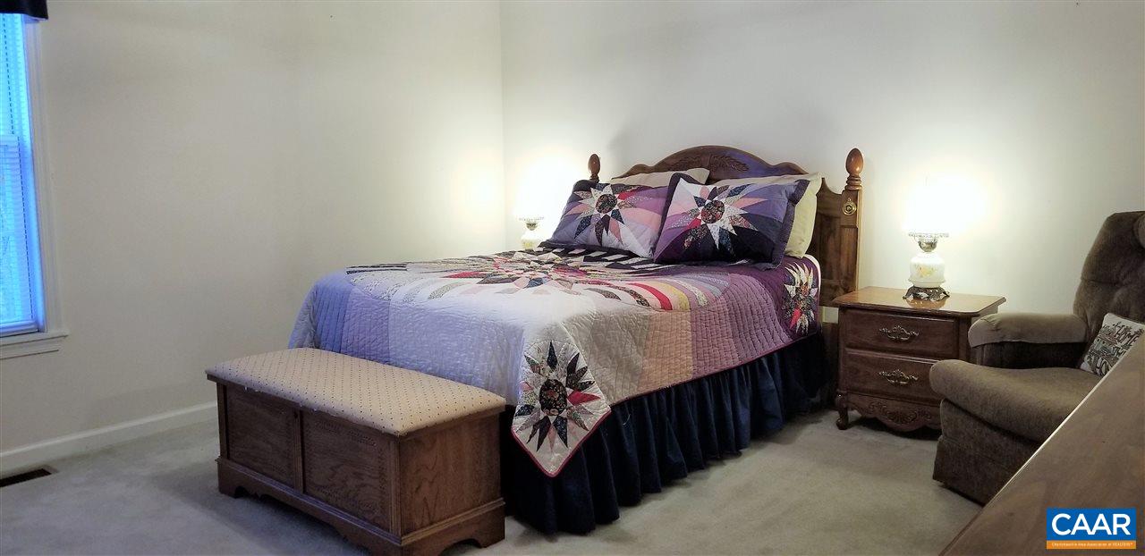 13 Colonial Road Palmyra, VA 22963 - Photo 17 of 34 a bedroom with a bed and a couch