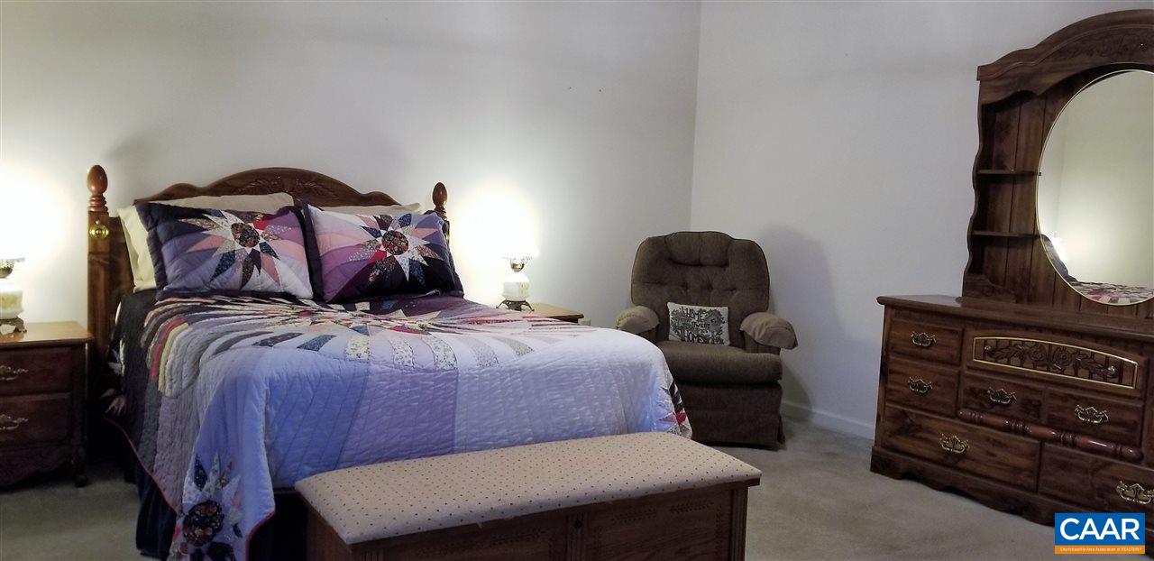 13 Colonial Road Palmyra, VA 22963 - Photo 18 of 34 a bed sitting in a bedroom next to a window