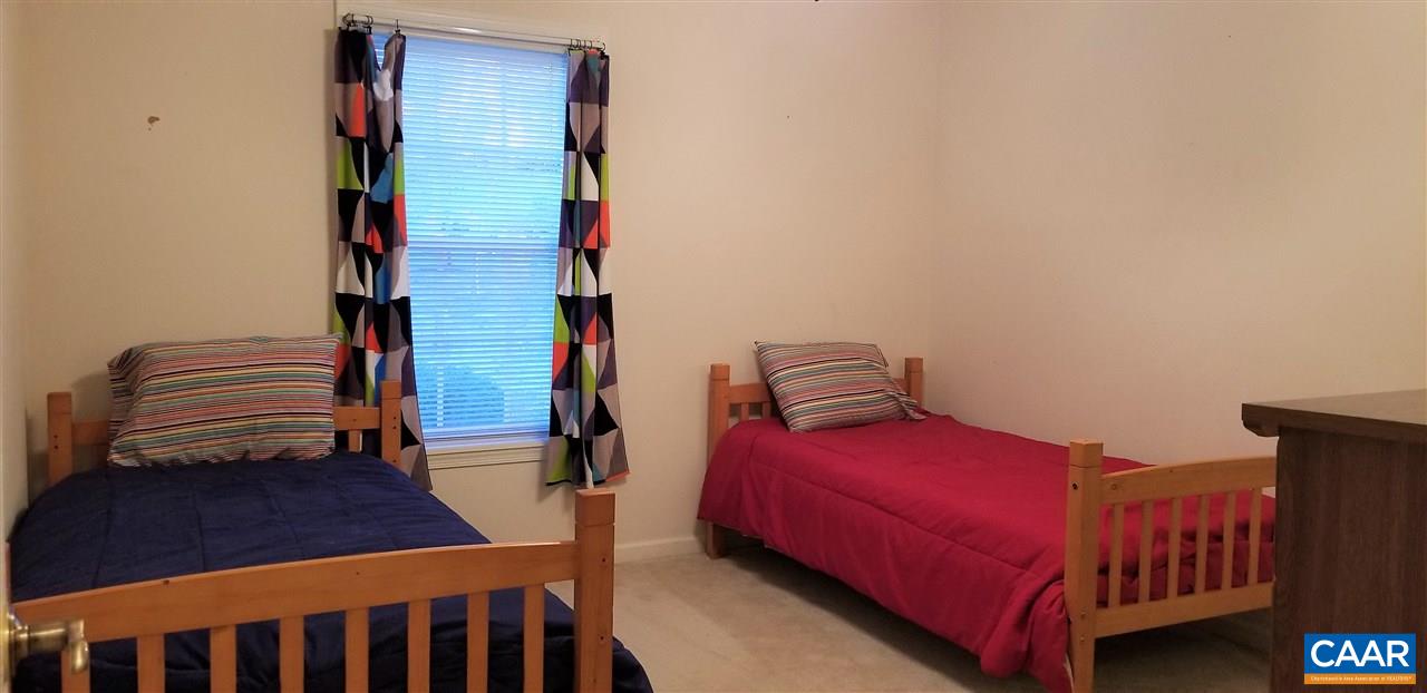 13 Colonial Road Palmyra, VA 22963 - Photo 24 of 34 a bedroom with a bed and wooden floor