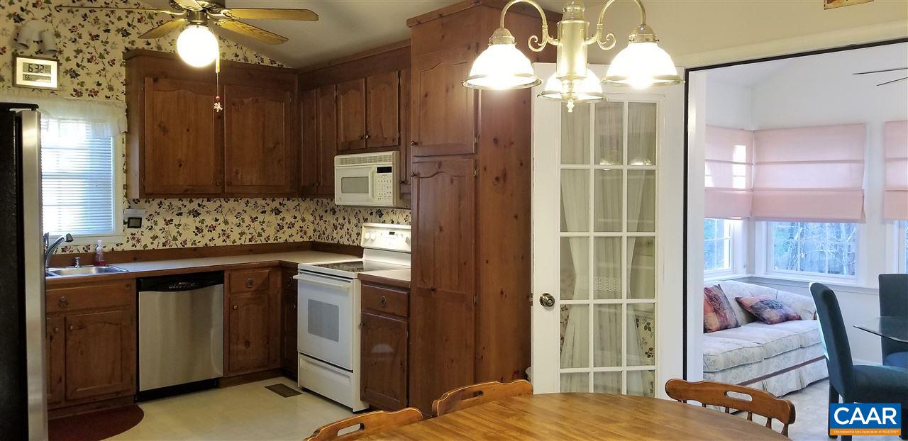 13 Colonial Road Palmyra, VA 22963 - Photo 3 of 34 a kitchen with stainless steel appliances granite countertop a stove and a refrigerator