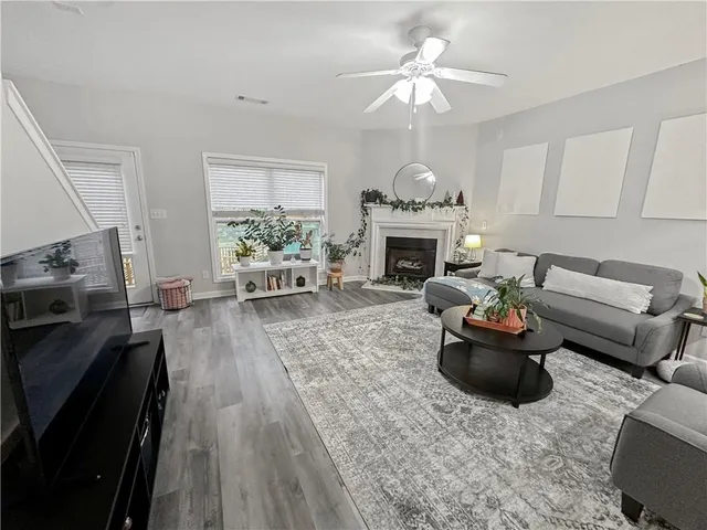 a white bath tub sitting next to a shower